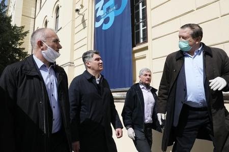 President, Rector and Dean discussing...
